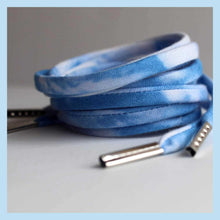 blue shoe strings close up with metal tips