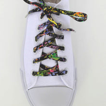 fun shoelaces with metal tips in a white sneaker